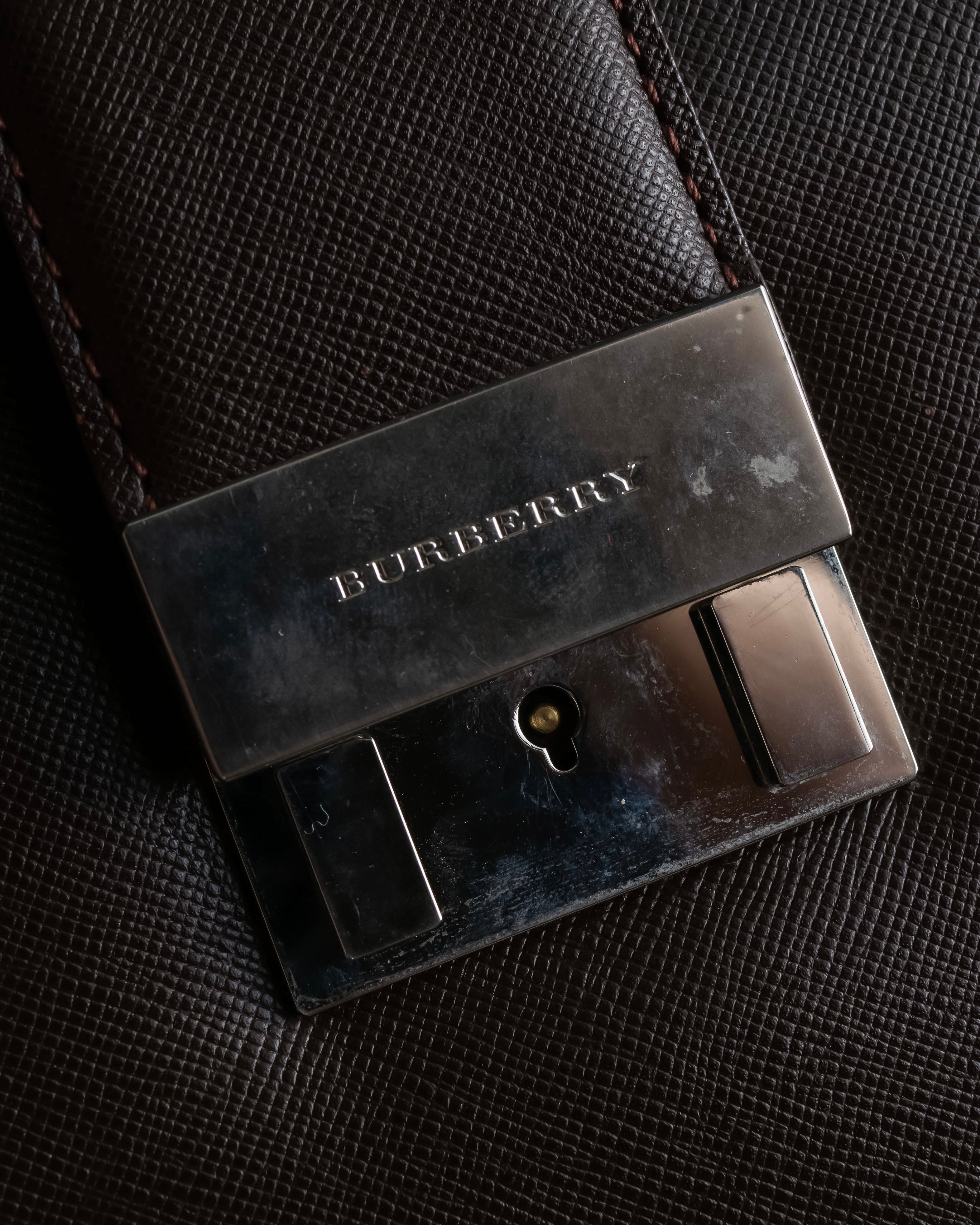 "BURBERRY" Metal belt design embossed PVC briefcase