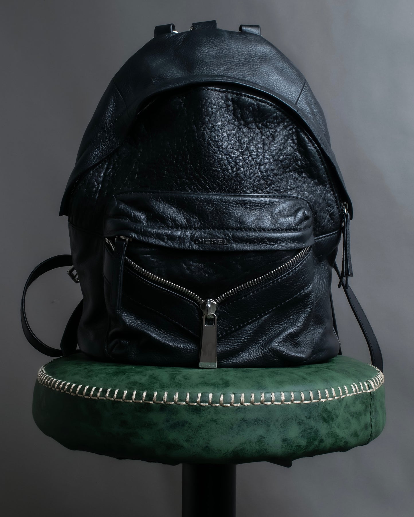 "DIESEL" Decorative zip design leather backpack