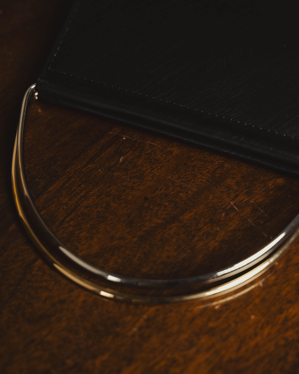"Cartier" 80's Sculptural ring-handle leather wallet