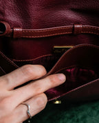 "Cartier" Texture changing bordeaux colored leather shoulder bag