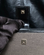 "GUCCI" Canvas and leather bi-fold wallet