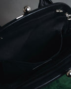 "Y’s" 22AW sculptural kiss-lock leather bag