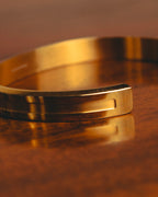 "Daniel Wellington" 20's Sleek gold cuff bracelet
