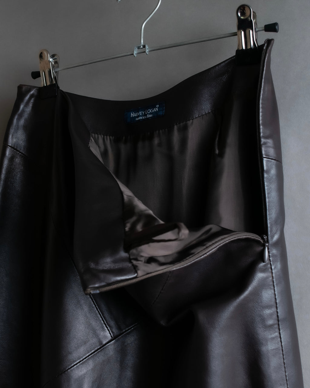 "HARVEY LOGAN" Diagonal cut design lamb leather flare skirt