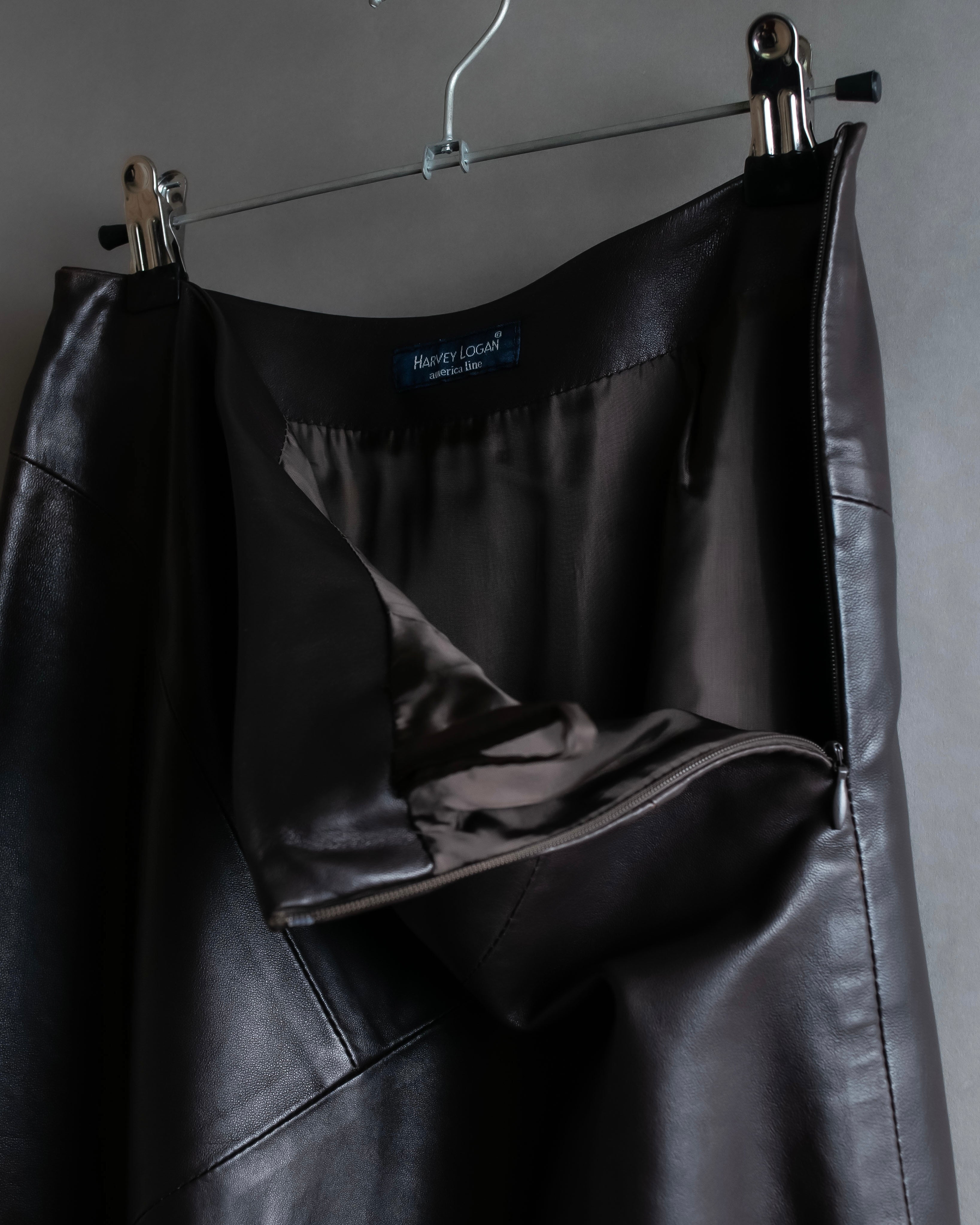 "HARVEY LOGAN" Diagonal cut design lamb leather flare skirt