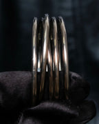 “PHILIPPE AUDIBERT” Crossed 5 line silver bangle