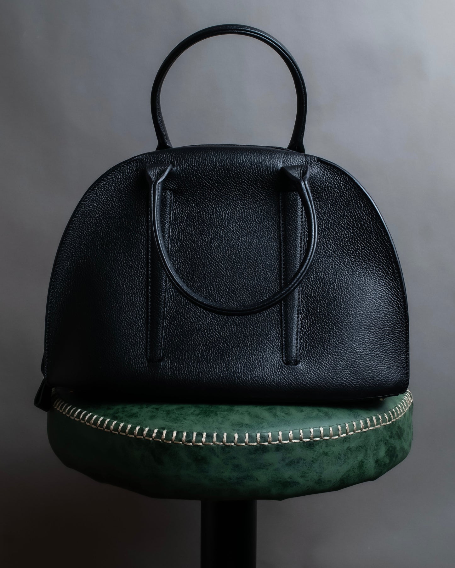 "MORABITO" Half moon design grained leather handbag