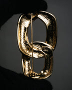 “Yves Saint Laurent” 80’s–90’s Sculptural chain motif brooch