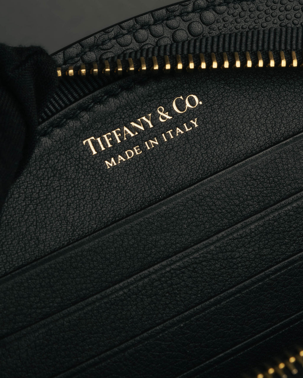 "Tiffany & Co." 10's-20's Embossed leather wristlet wallet