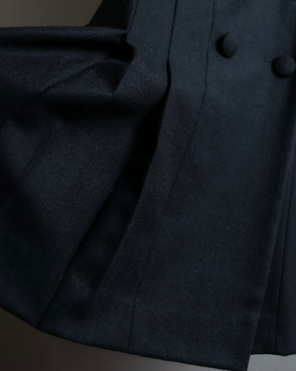 Tight-waisted wool shirt and black coat