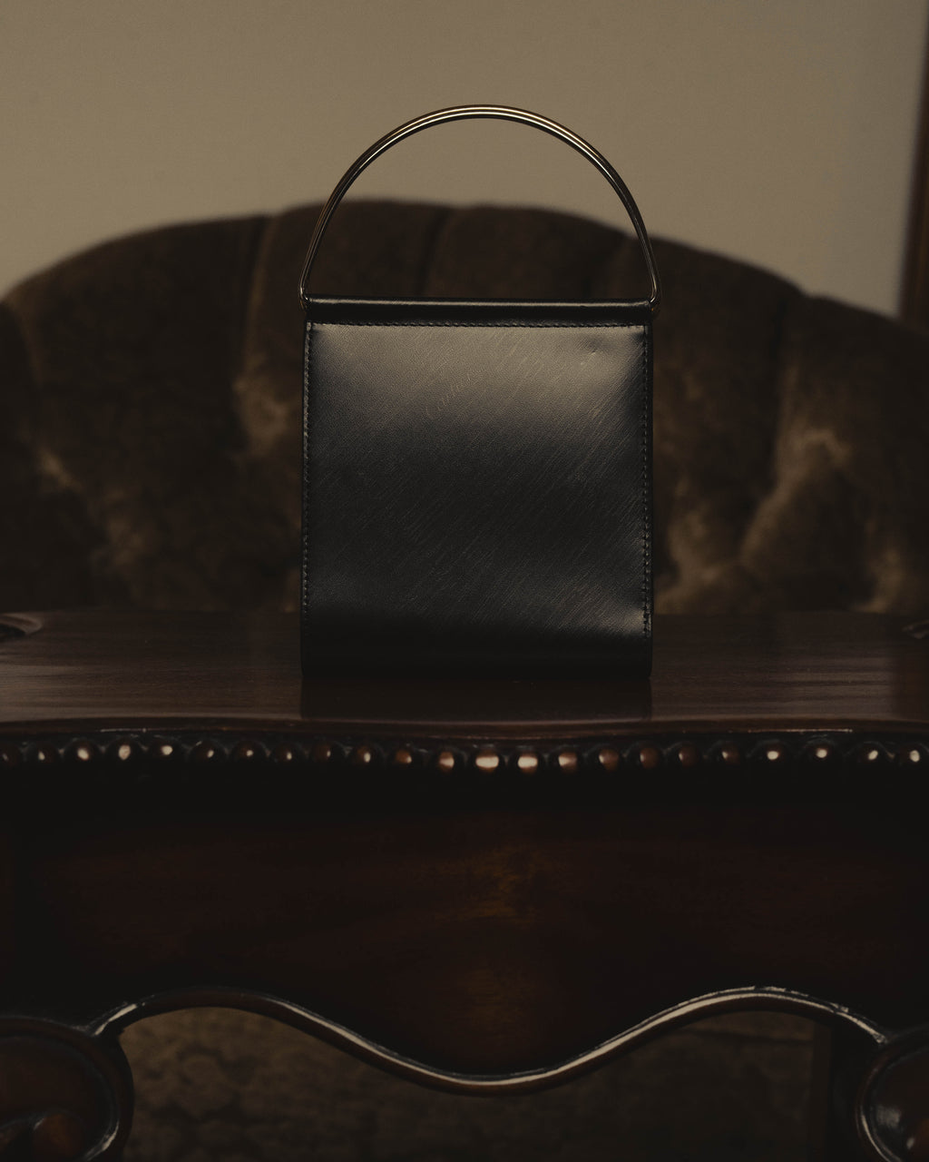 "Cartier" 80's Sculptural ring-handle leather wallet