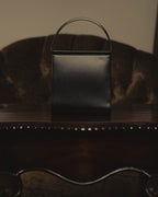 "Cartier" 80's Sculptural ring-handle leather wallet