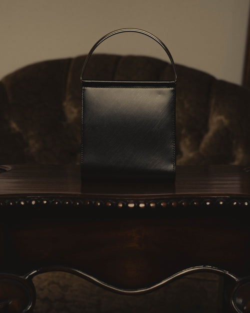 "Cartier" 80's Sculptural ring-handle leather wallet
