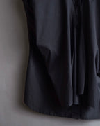 "Yves Saint Laurent Rive Gauche"
Twisted front sleeveless shirt