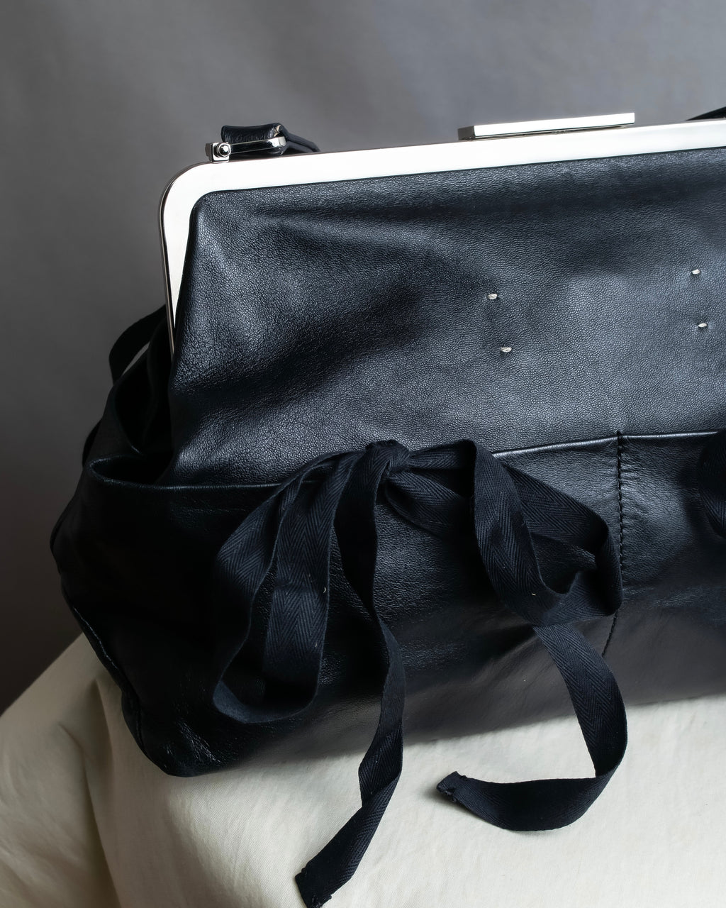 "MARNI" Side ribbon design rounded body leather bag