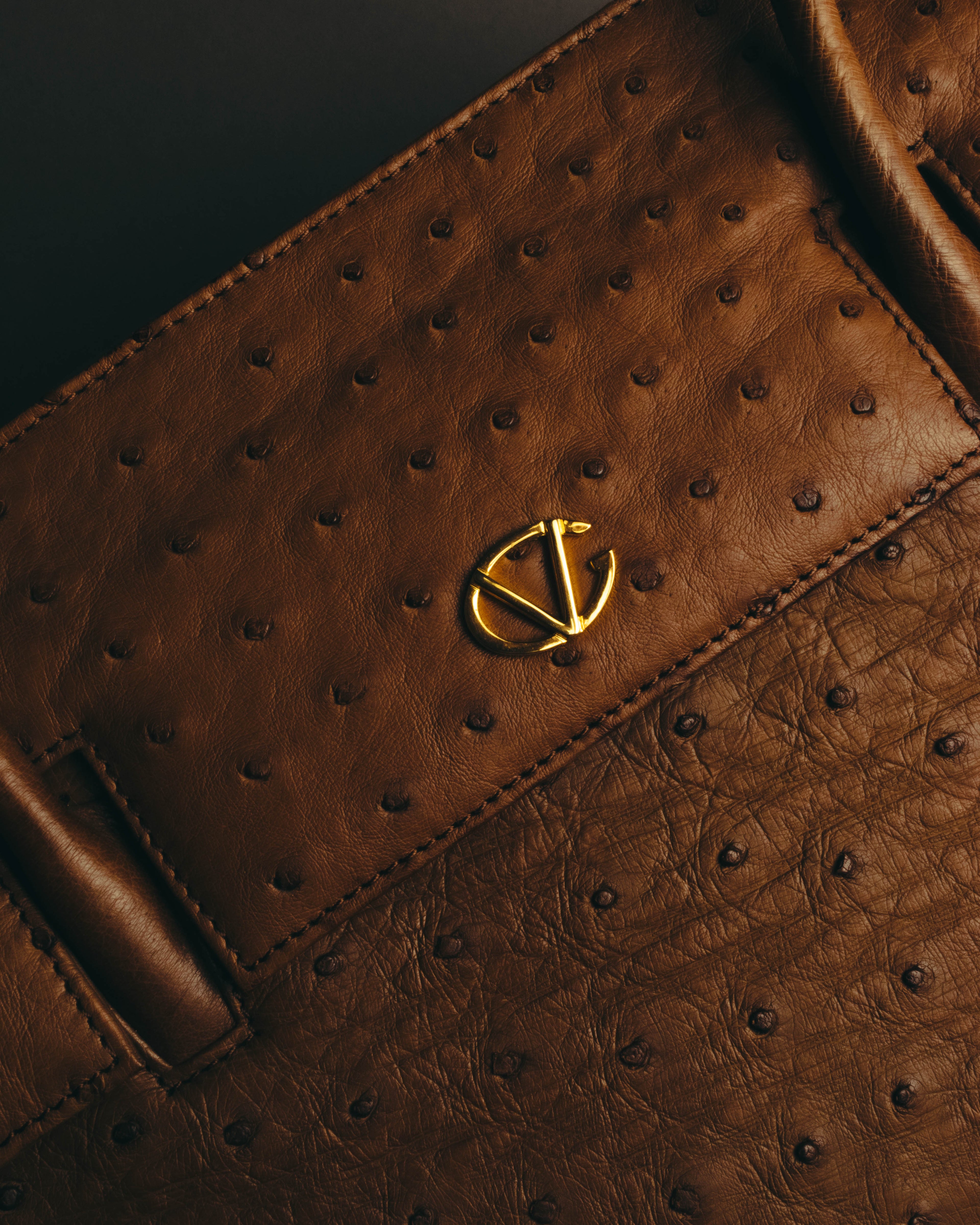 “GIOVANNI VALENTINO” Structured ostrich top handle bag