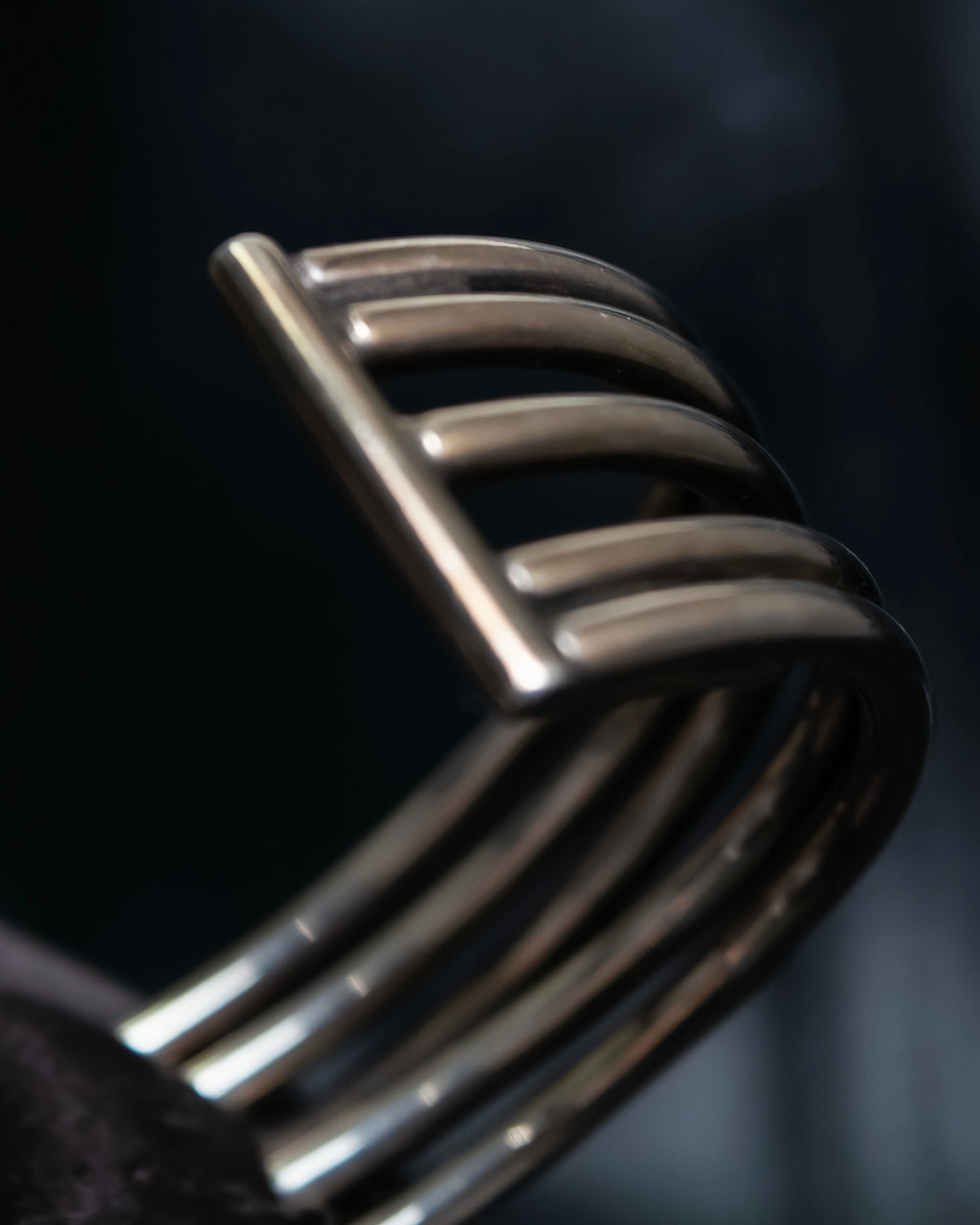 “PHILIPPE AUDIBERT” Crossed 5 line silver bangle