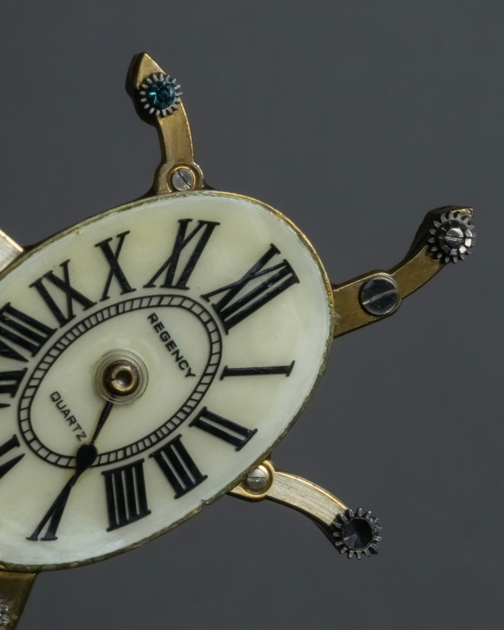 "Jerry Robertson design clock motif brooch"