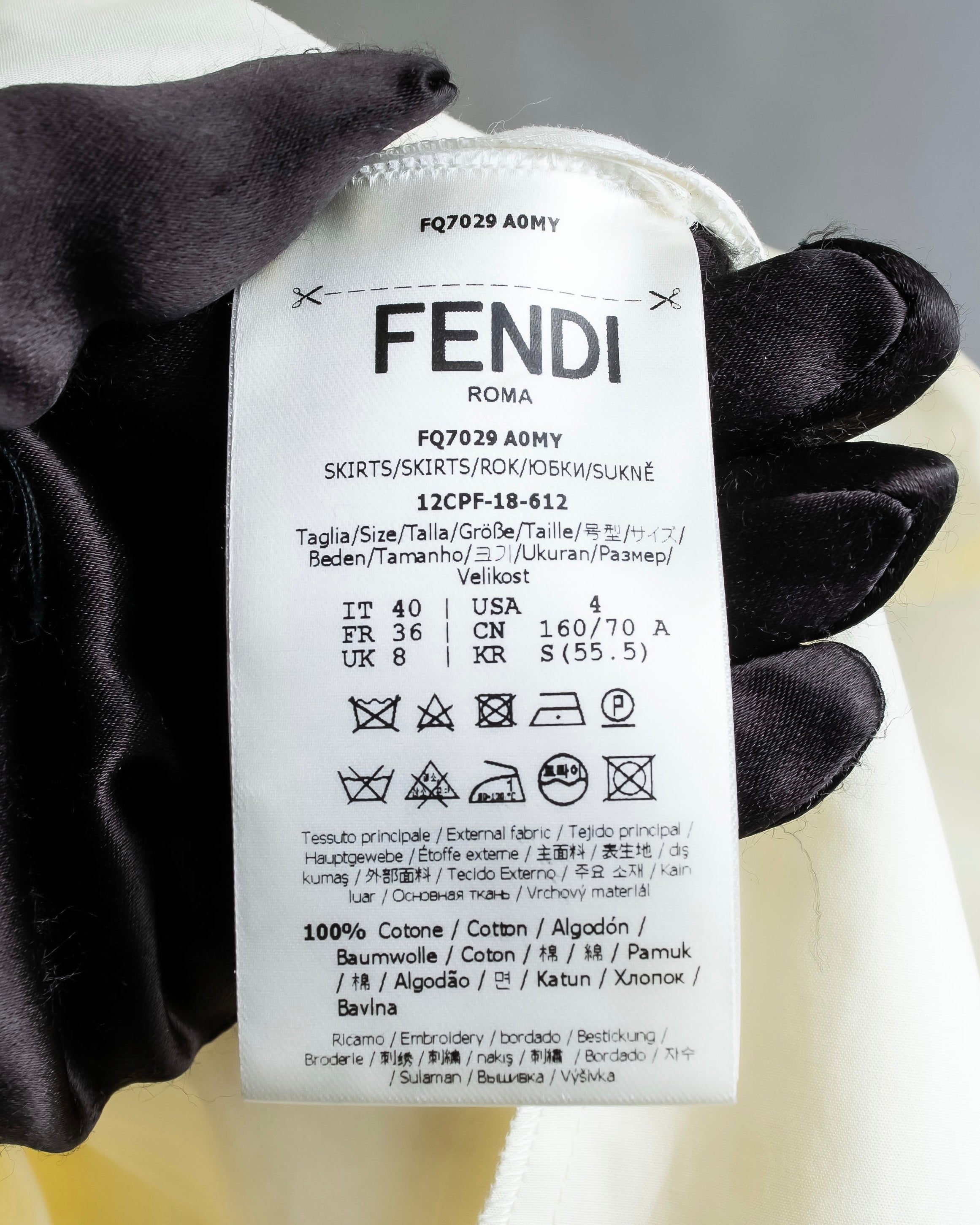 "FENDI" hole pattern and tack designed skirt