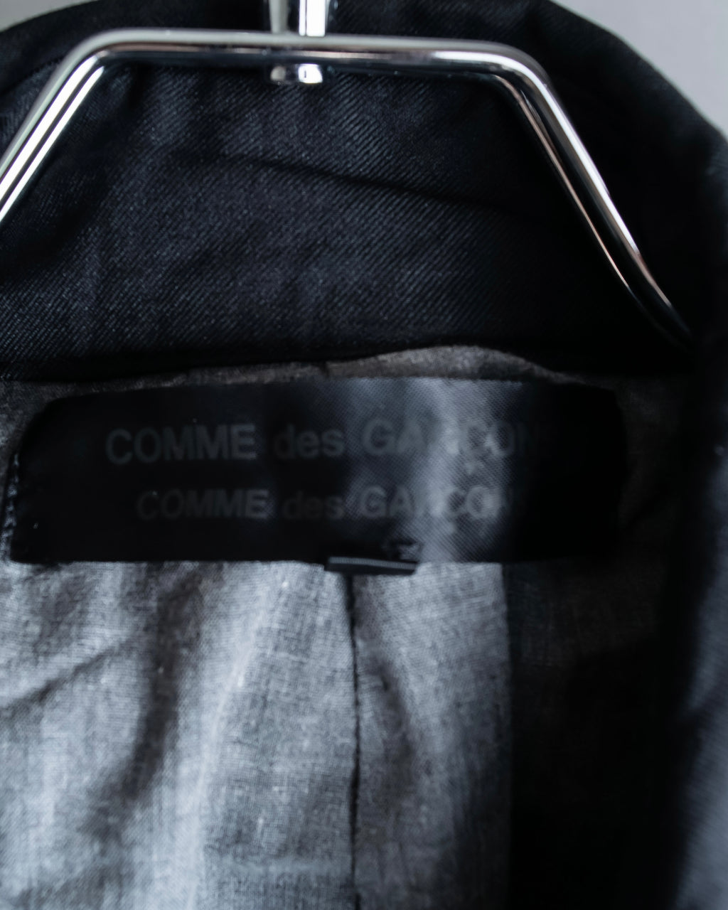 "COMME des GARCONS
COMME des GARCONS" 6 button detail raw edge jacket