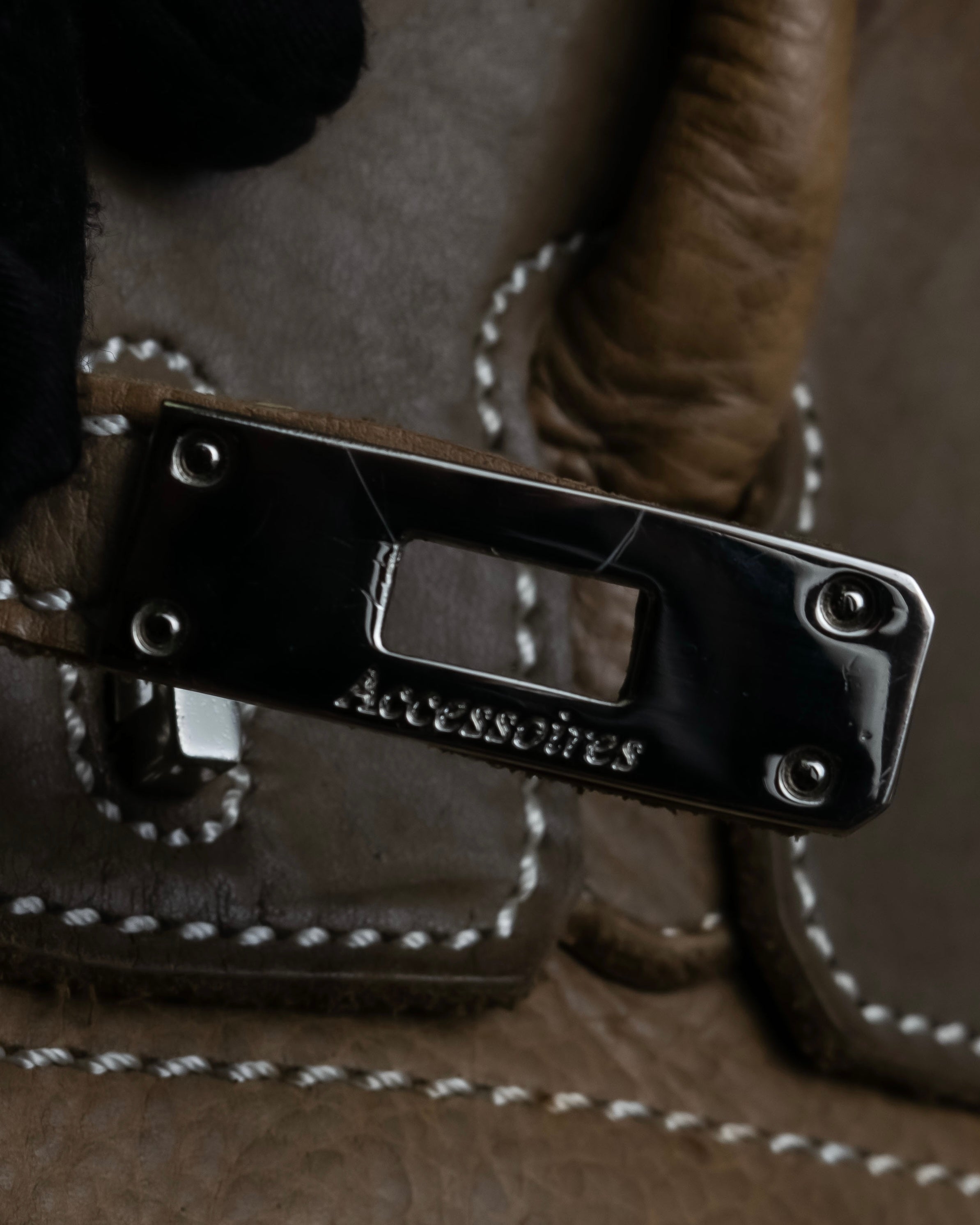 "Mademoiselle Accessories"
 Silver parts design leather one handle bag