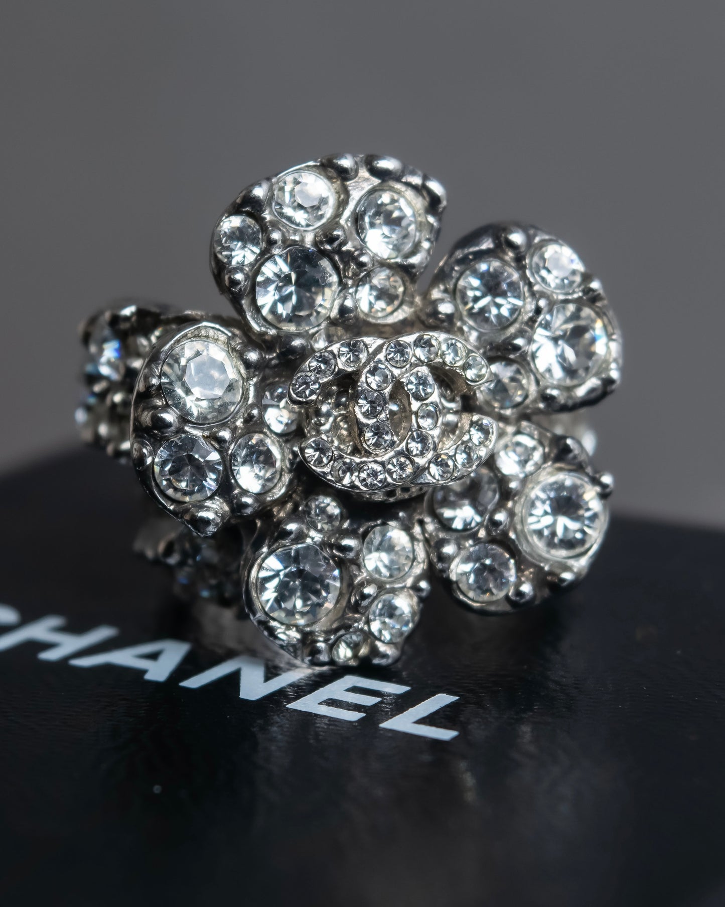 "CHANEL" Cocomark engraved rhinestone design camellia ring