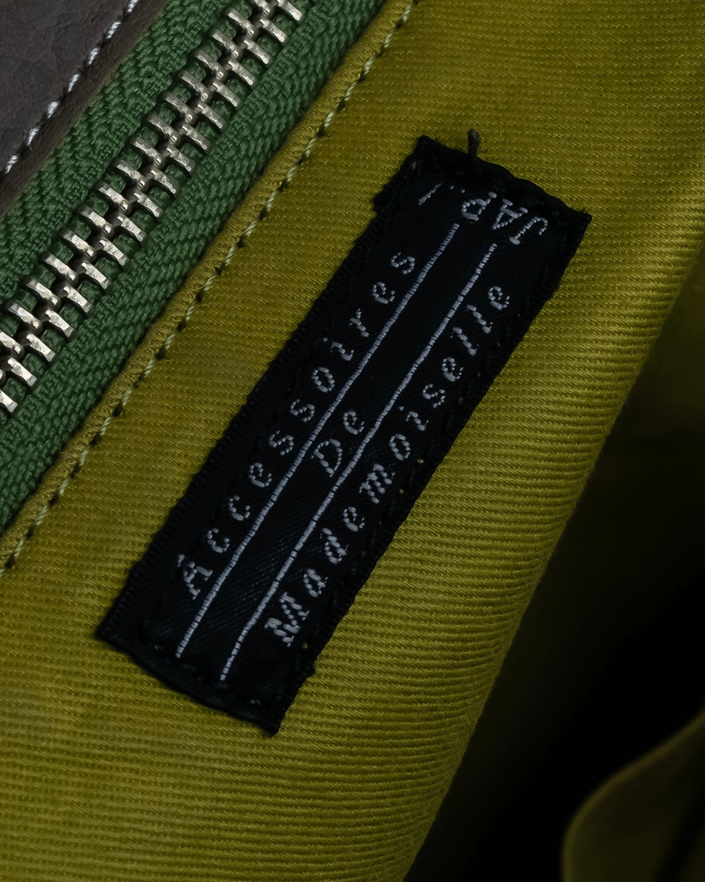 "Mademoiselle Accessories"
 Silver parts design leather one handle bag