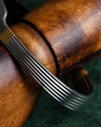 "Christian Dior" Ribbed design gold combination polished silver bangle