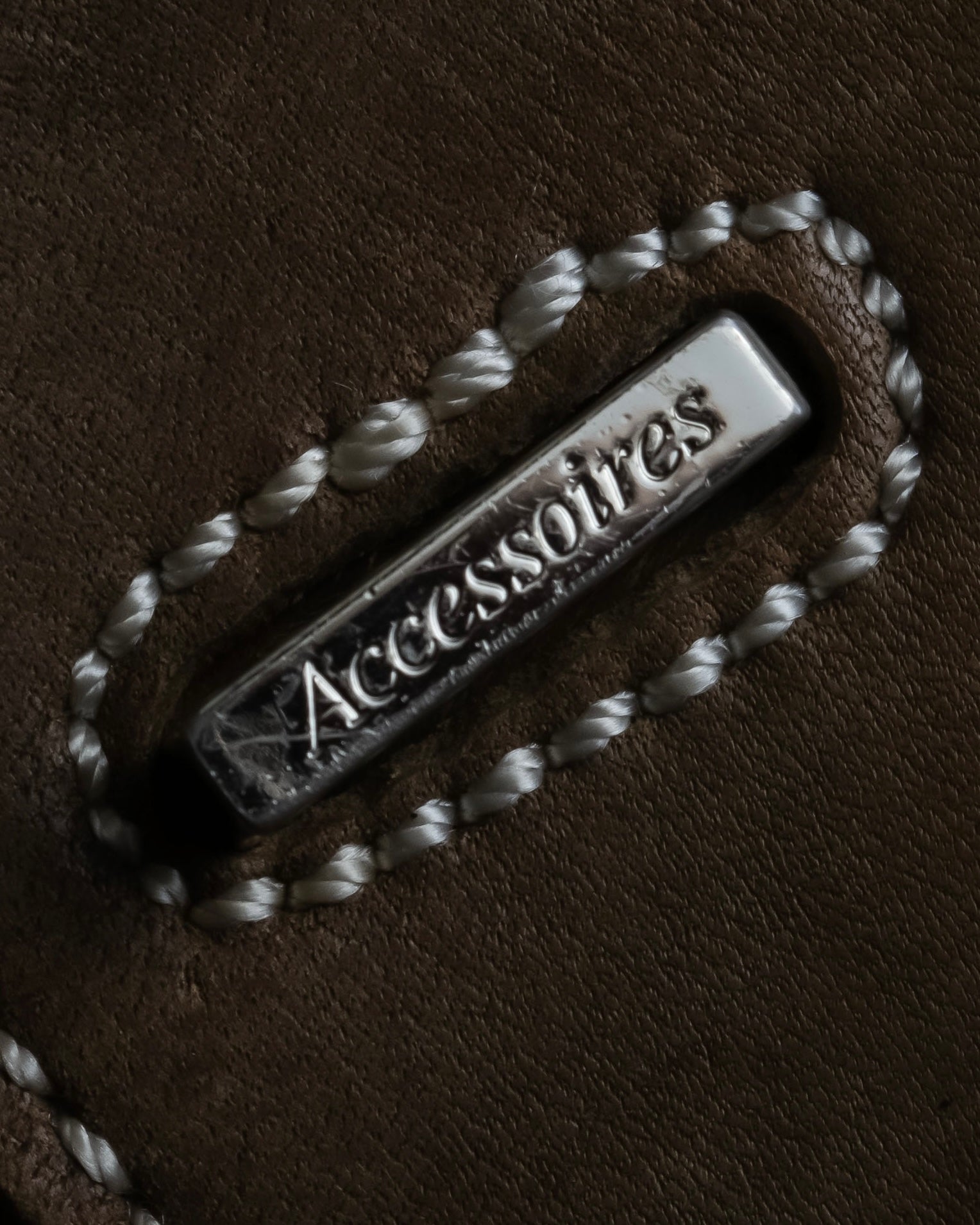 "Mademoiselle Accessories"
 Silver parts design leather one handle bag