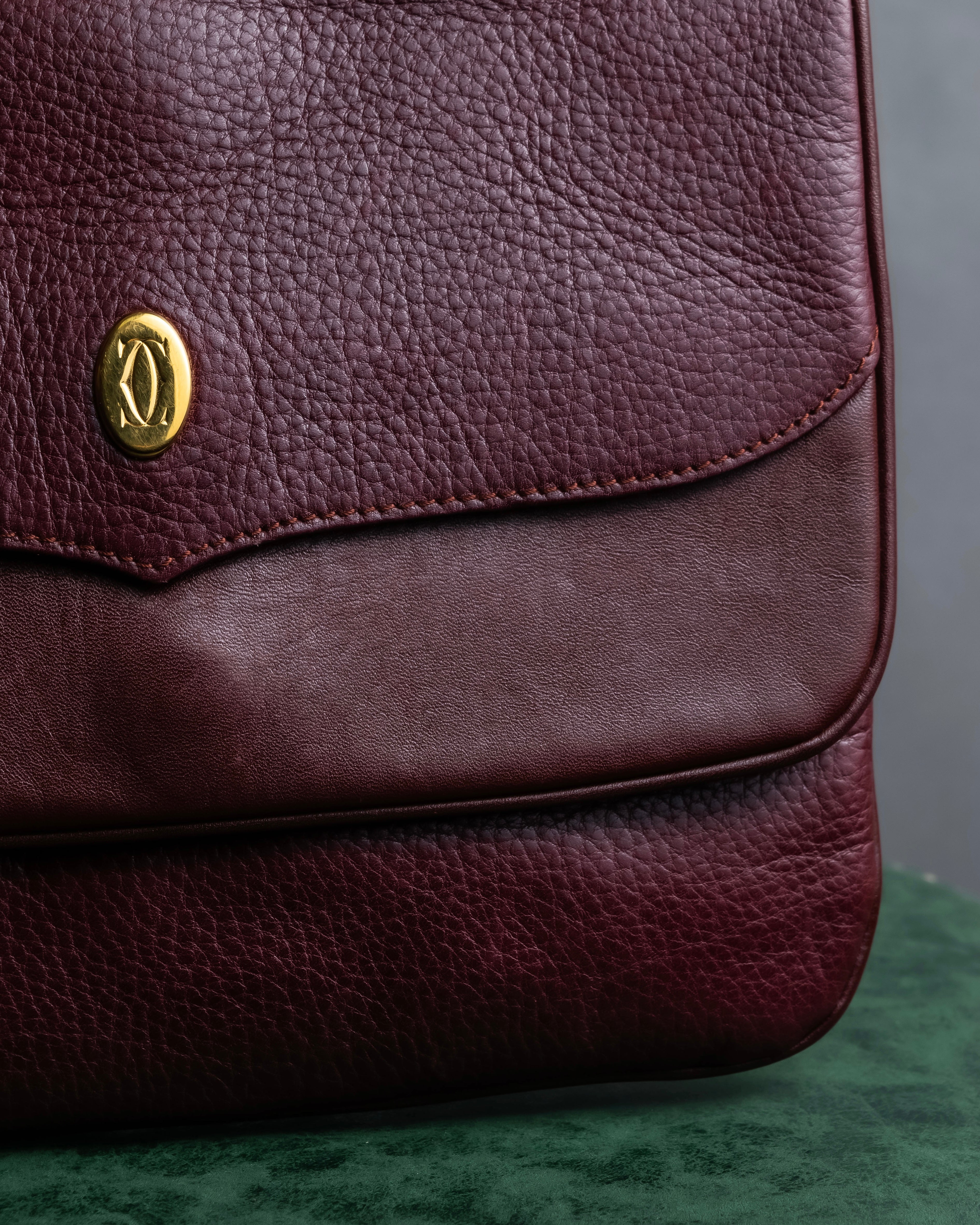 "Cartier" Texture changing bordeaux colored leather shoulder bag