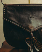 “Yves Saint Laurent” 70’s-80’s Perforated logo leather tassel shoulder bag