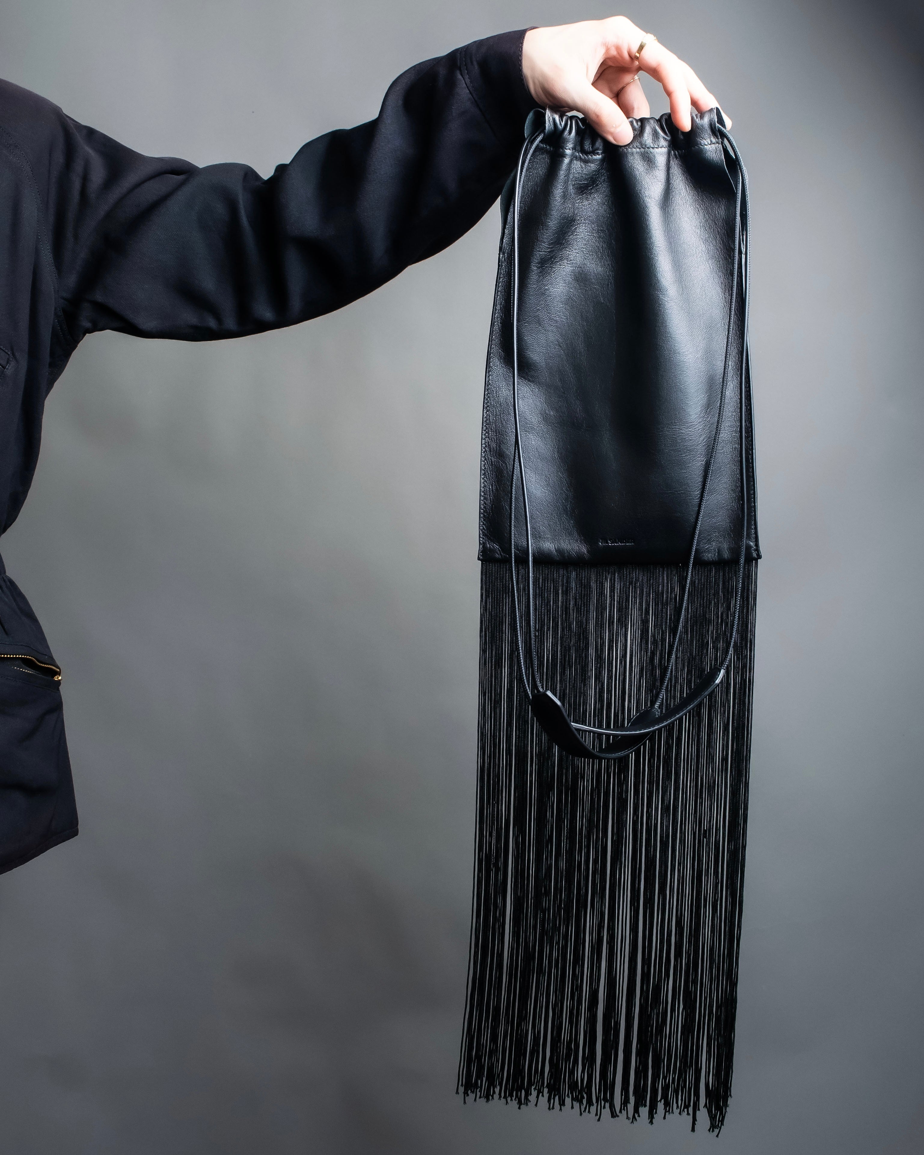 “JIL SANDER” Fringe detail flat drawstring shoulder bag