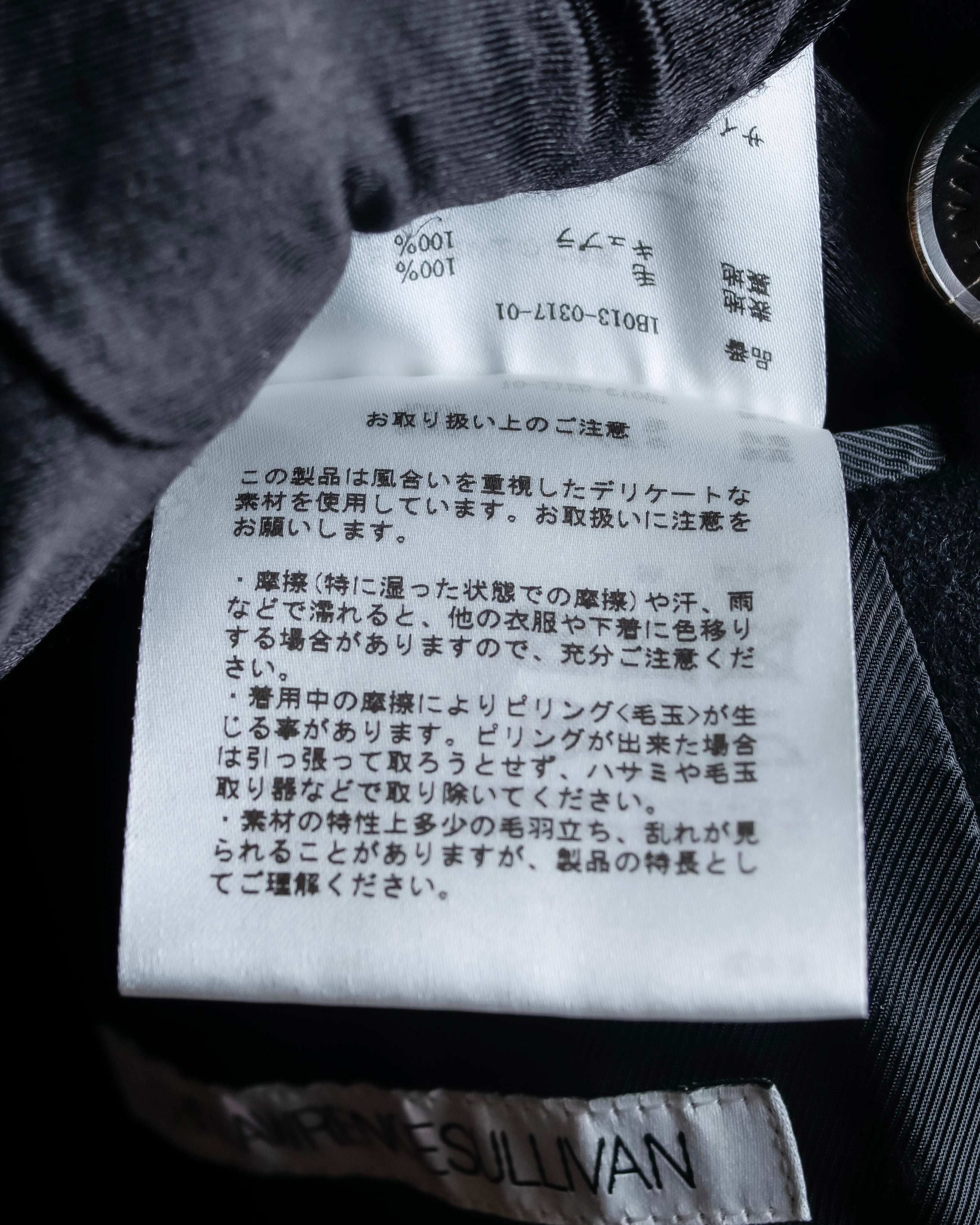 "JOHN LAWRENCE SULLIVAN"
 Large lapel double-breasted mid length coat