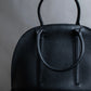 "MORABITO" Half moon design grained leather handbag