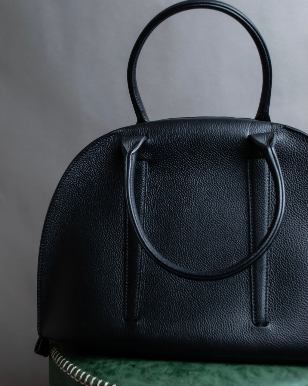 "MORABITO" Half moon design grained leather handbag