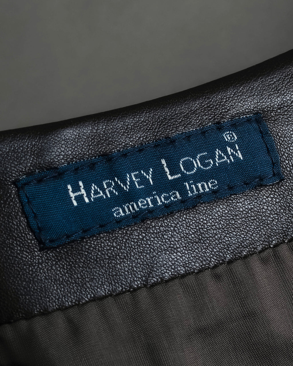 "HARVEY LOGAN" Diagonal cut design lamb leather flare skirt