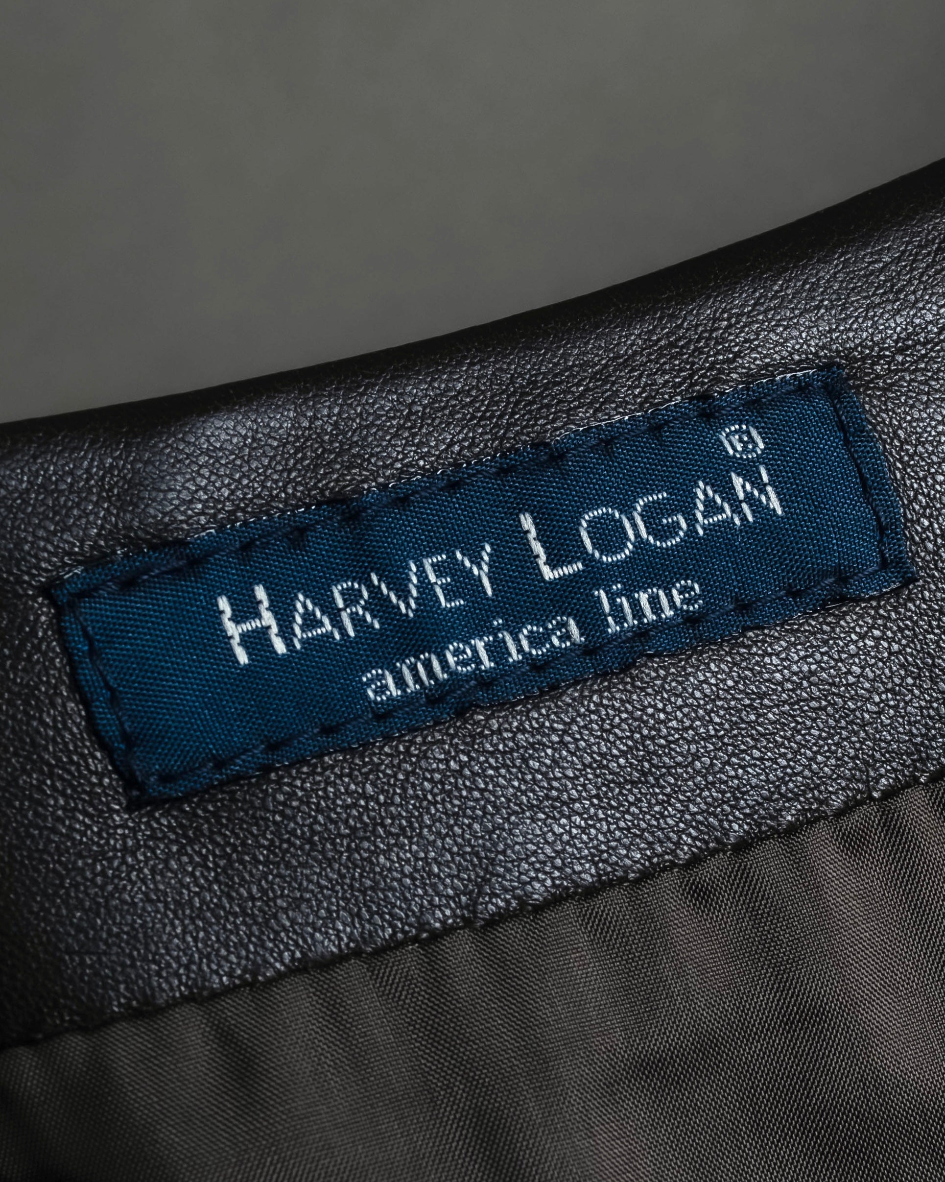 "HARVEY LOGAN" Diagonal cut design lamb leather flare skirt