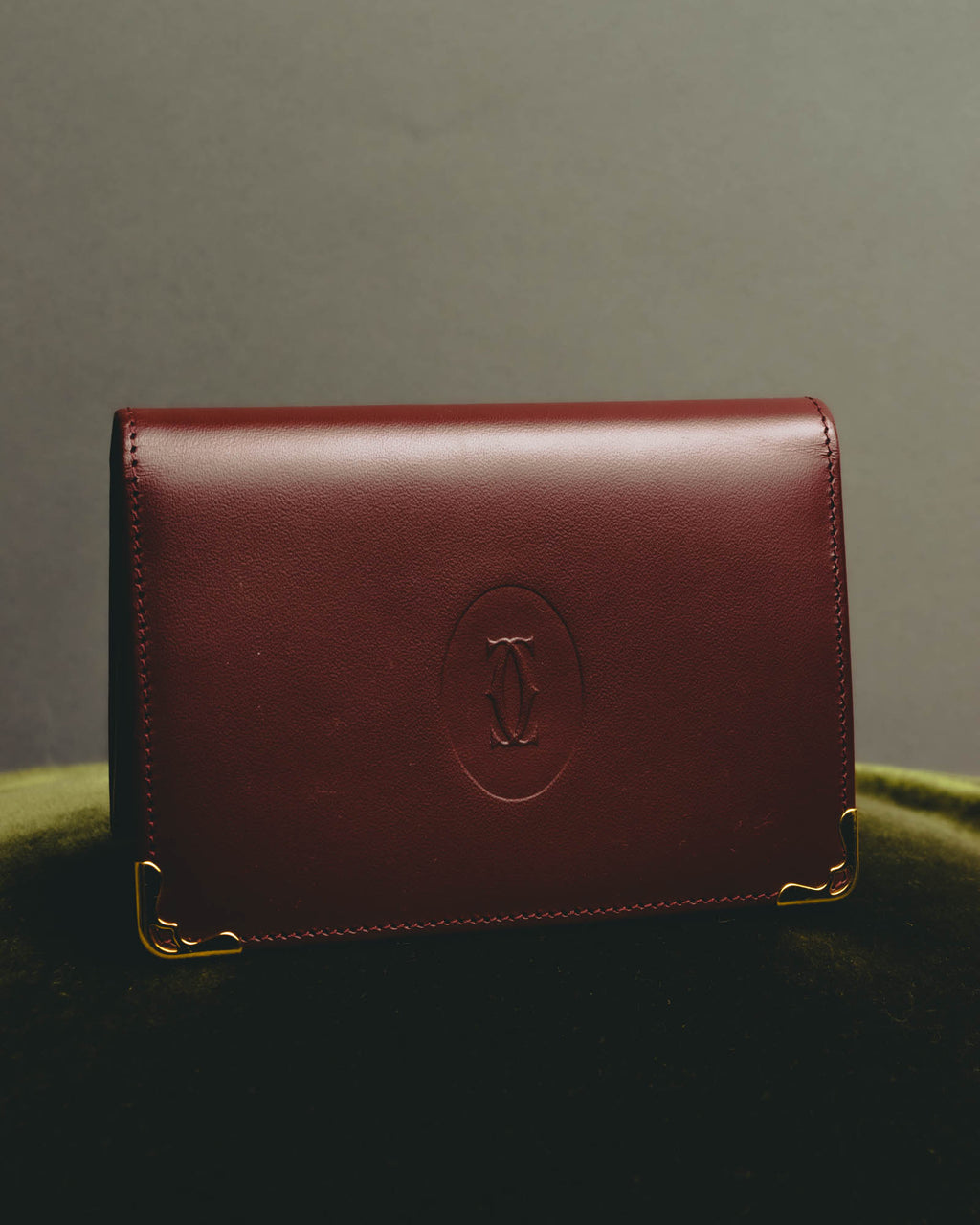 “Cartier” 90’s Must de Cartier burgundy embossed leather bifold wallet