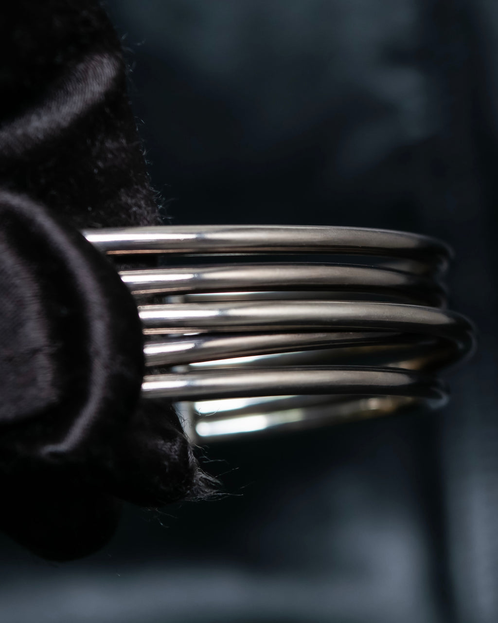 “PHILIPPE AUDIBERT” Crossed 5 line silver bangle