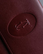 "Cartier" Les Must de Cartier bordeaux color leather wallet