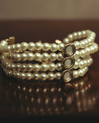 –SPECIAL– “Christian Dior” 2018-2025 Four-strand faux pearl bracelet with sculptural oval accents