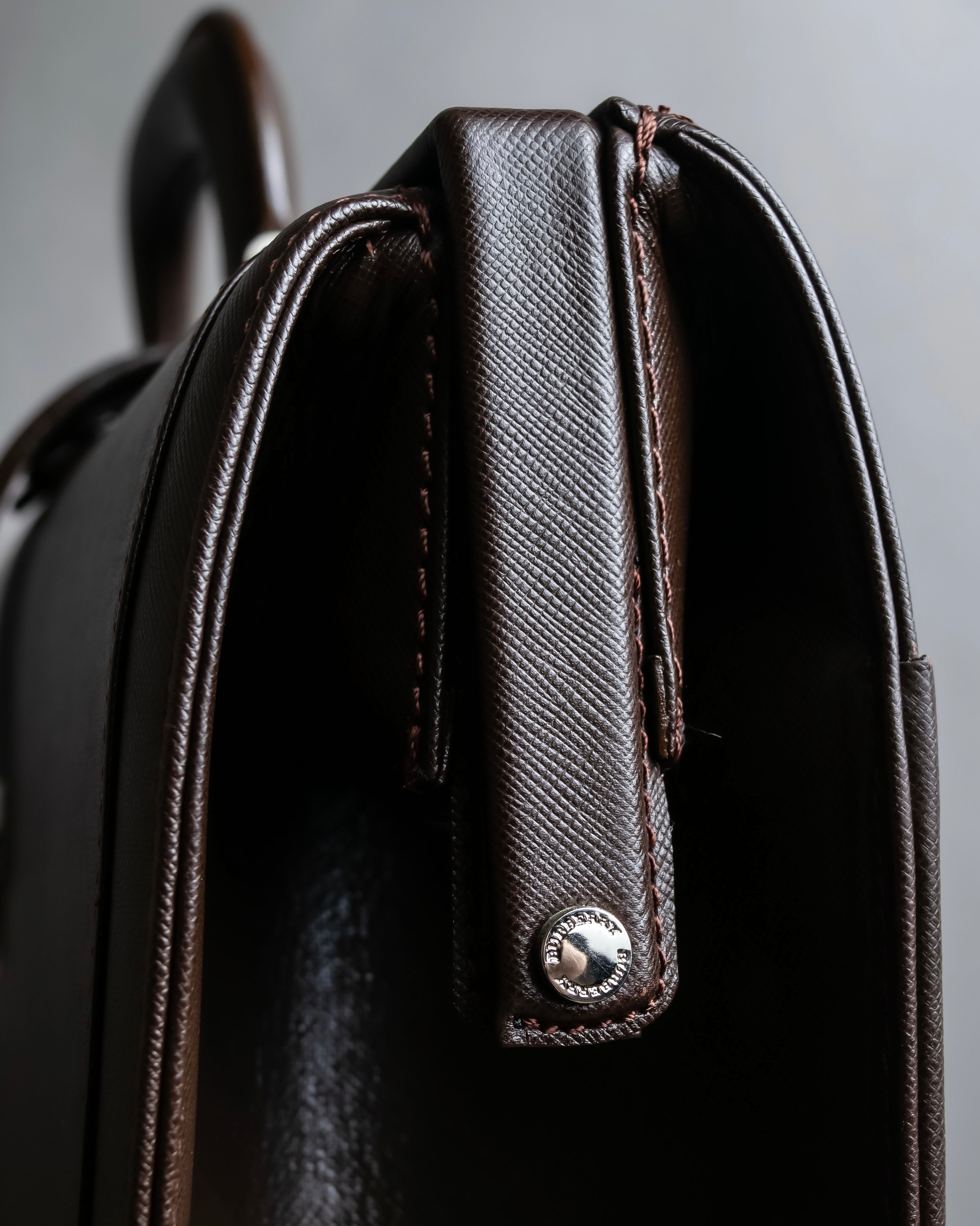 "BURBERRY" Metal belt design embossed PVC briefcase