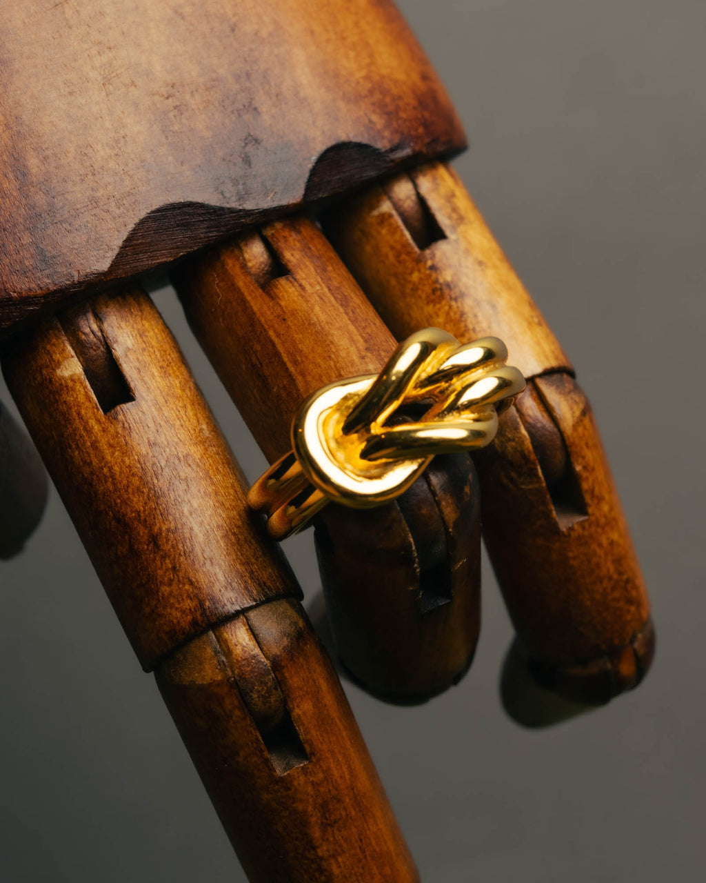 "HERMES" Sculptural gold tone knot Atame scarf ring
