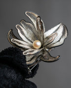 "Vintage petal motif broach"