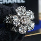 "CHANEL" Cocomark engraved rhinestone design camellia ring