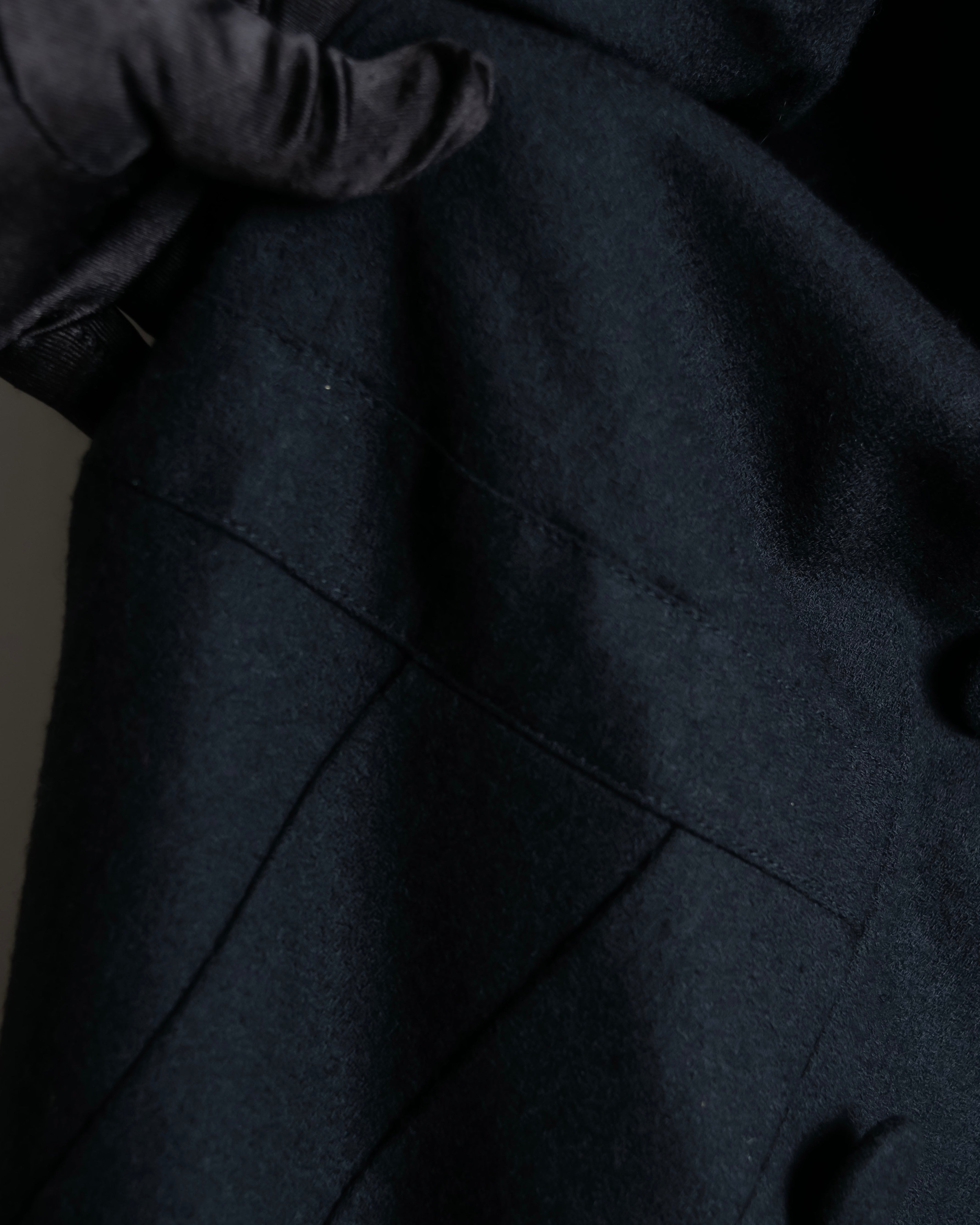 Tight-waisted wool shirt and black coat