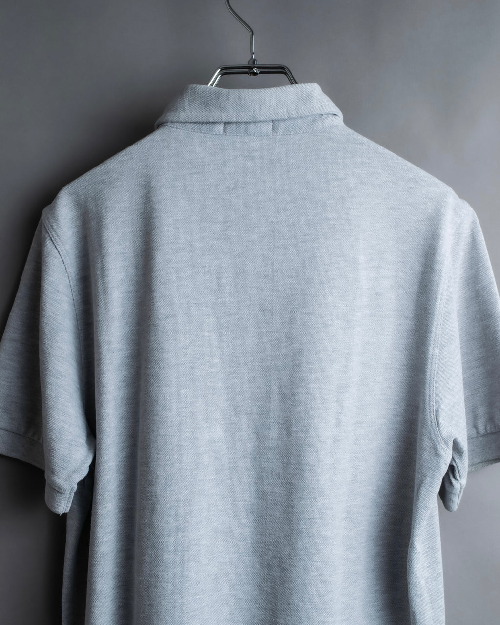 "BURBERRY" Knight logo engraved metal button polo shirt