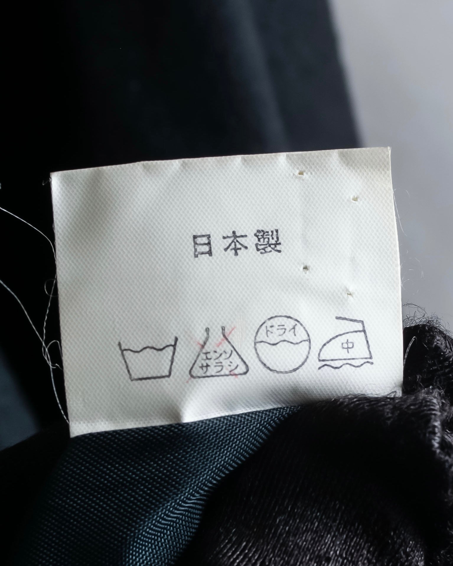 Tight-waisted wool shirt and black coat