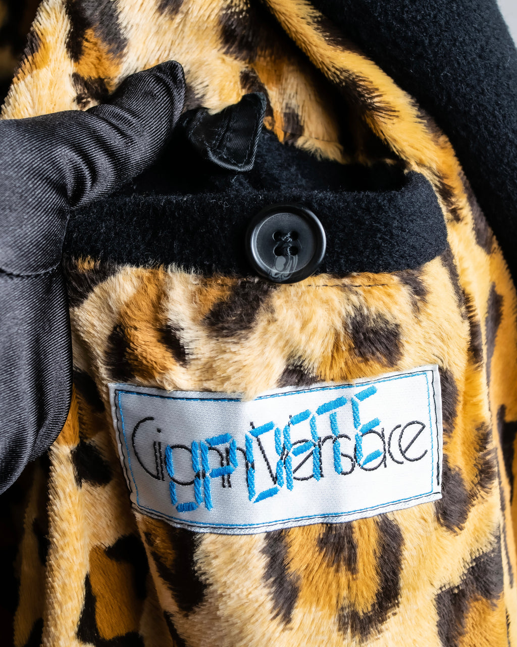 "GIANNI VERSACE UPDATE"
 Fur trimmed wool cashmere maxi double breasted coat