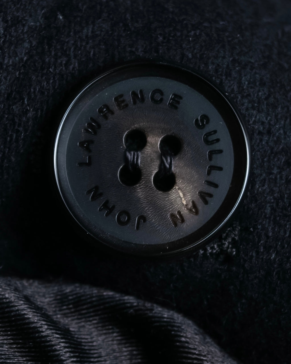 "JOHN LAWRENCE SULLIVAN"
 Large lapel double-breasted mid length coat